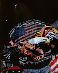 a man wearing a jacket with an eagle on it